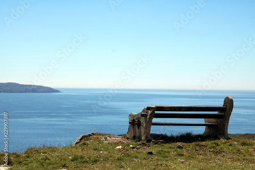 Broken bench overlooking the sea