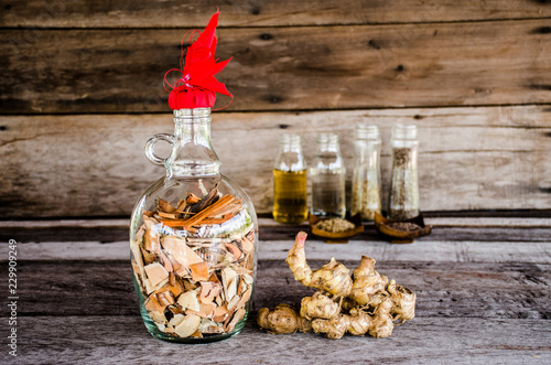 herbal liqour on wood background photo