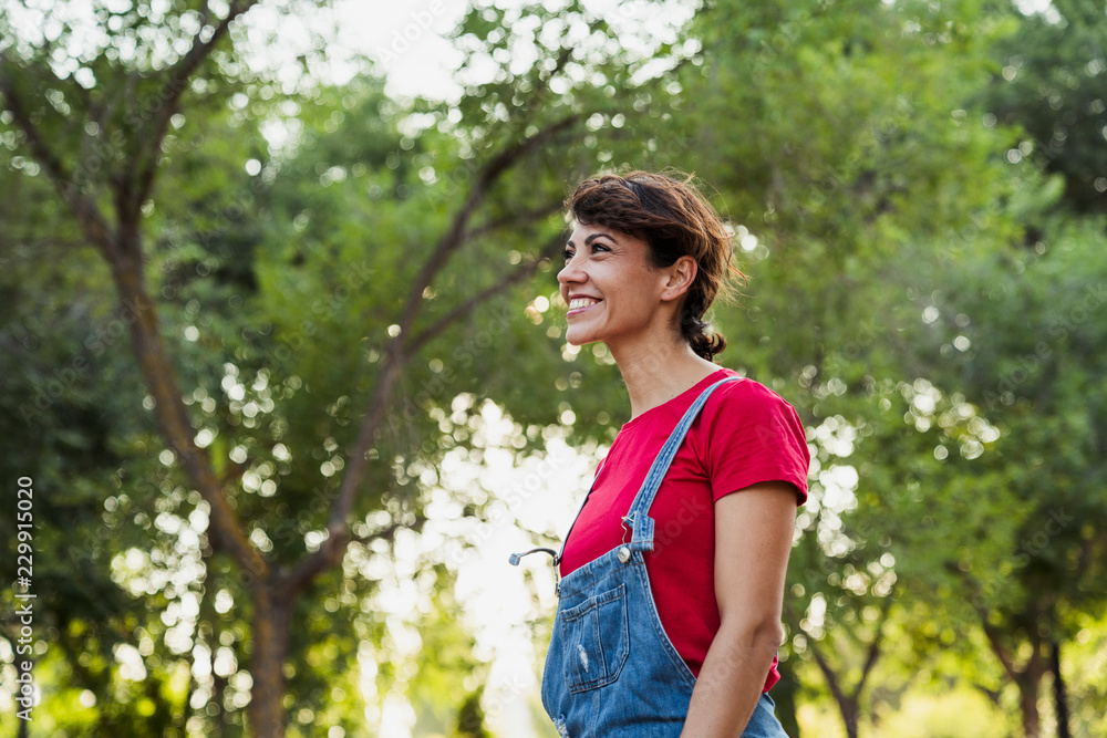 Smiling woman relaxing in nature Smiling woman relaxing in nature