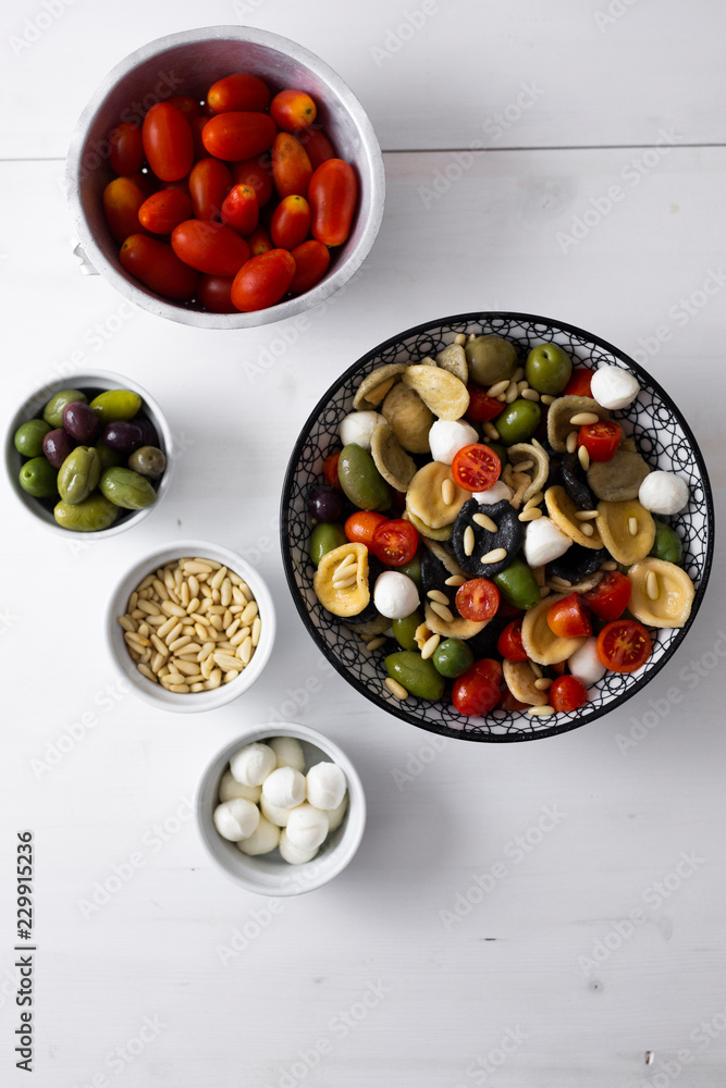 Mediterranean orecchiette with tomato, olives, mozzarella Mediterranean orecchiette with tomato, olives, mozzarella