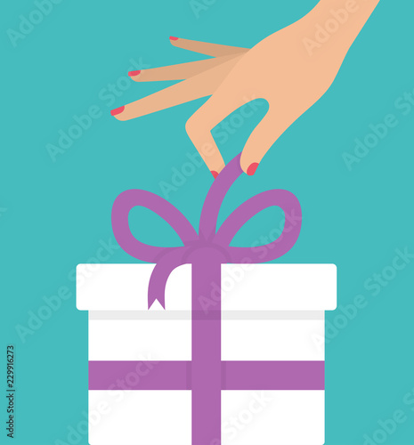 Woman's hand unboxing or unwrapping white gift box with purple ribbon