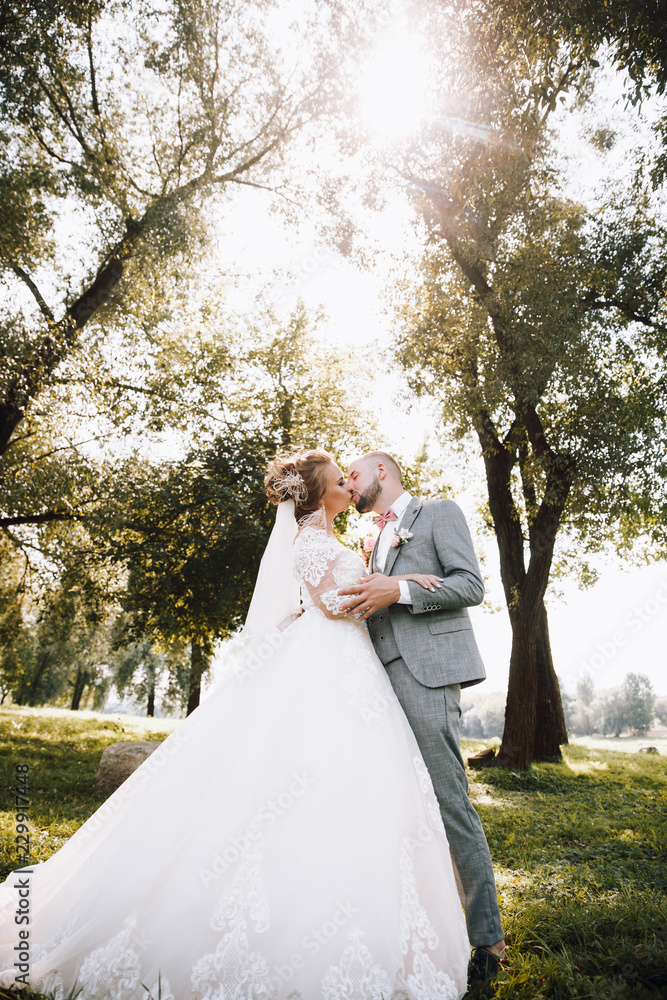 Bride and groom in a park.Wedding Couple.Wedding photo shooting Bride and groom in a park.Wedding Couple.Wedding photo shooting