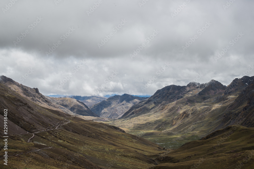 Landscape of the Vilcanota mountain chain, near by the famous rainbow mountain, in a cloudy day of october. Perù. Landscape of the Vilcanota mountain chain, near by the famous rainbow mountain, in a cloudy day of october. Perù.
