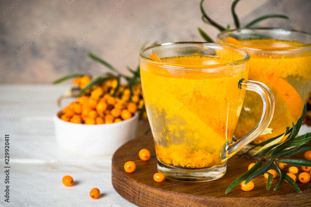 Sea buckthorn tea with orange in a glass cups. Sea buckthorn tea with orange in a glass cups.