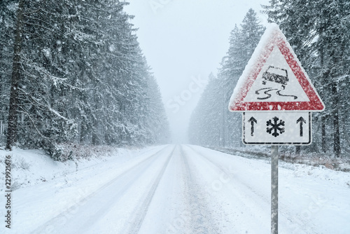 Winter Driving - Heavy snowfall on a country road. Driving on it becomes dangerous …