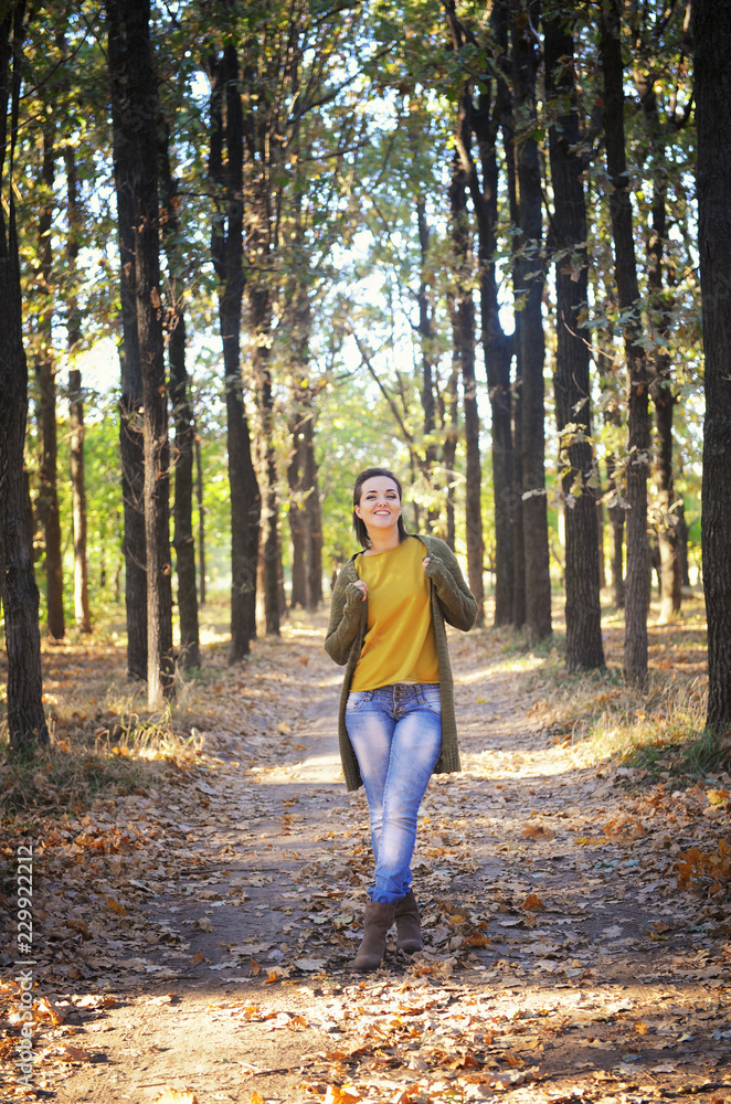 Young woman resting in autumn park and hiking, casual wear Young woman resting in autumn park and hiking, casual wear