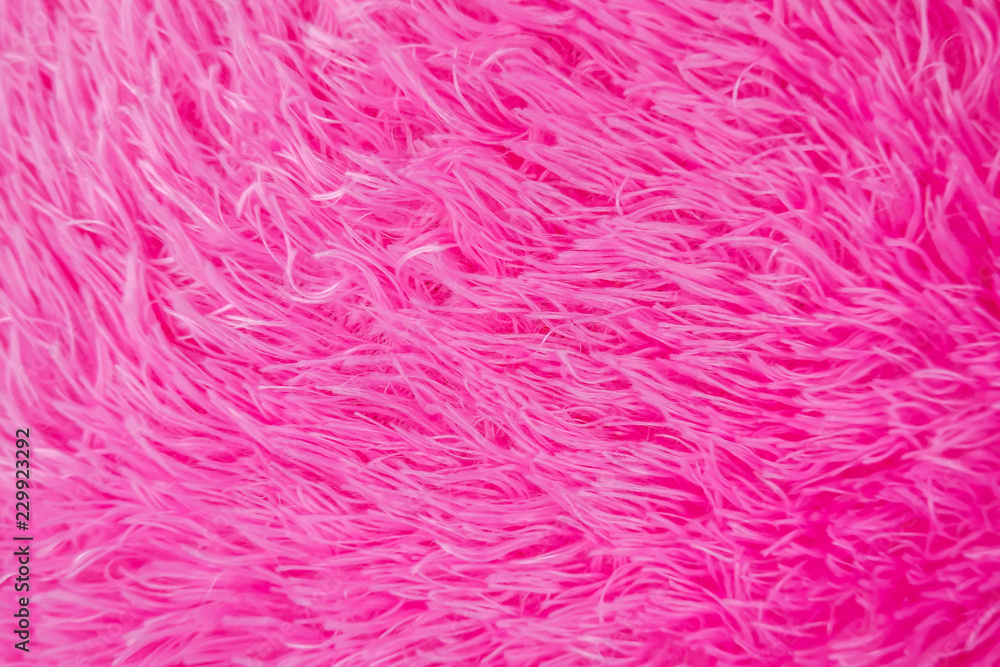 Close up pink shaggy artificial fur texture or carpet for background. Close up pink shaggy artificial fur texture or carpet for background.