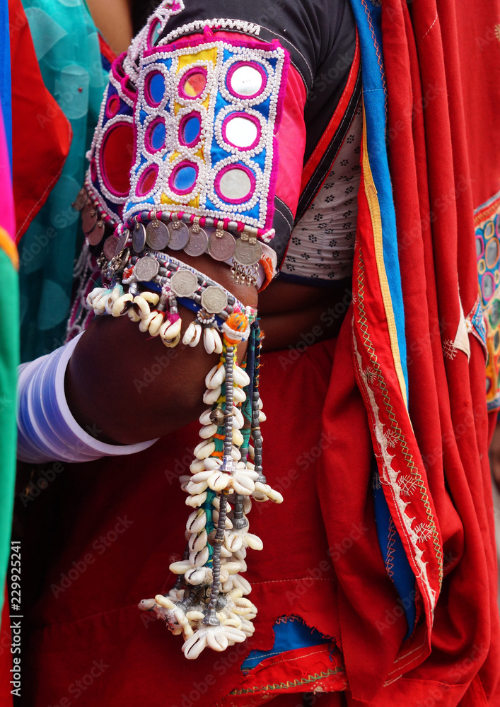 Closeup view of Indian nomadic tribe lambada woman decorated dress and accessories