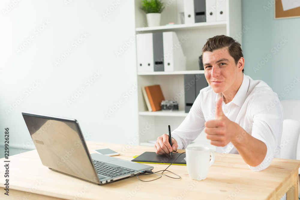 Business, humor and people concept - Young graphic designer man in white shirt gesture thumb up