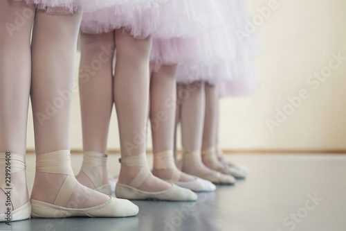 Little dancers legs in pointe shoes, making exercises © Prostock-studio
