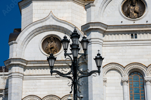 Old street lamp with the Cathedral of Christ the Saviour in the background (Khram Khrista Spasitelya). Moscow, Russia photo