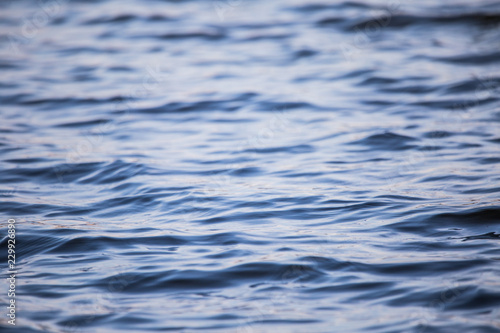 A beautiful water surface close up in the river. Waves with some reflections. Riga, Latvia.