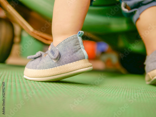 tiny foot try to go higher for little baby start learing to step walk