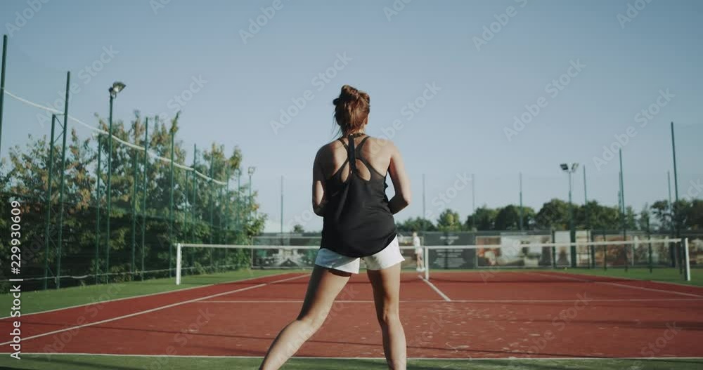 Full court tennis game outdoor , two professional tennis players females in slow motion. Shot on red epic. 4k Full court tennis game outdoor , two professional tennis players females in slow motion. Shot on red epic. 4k