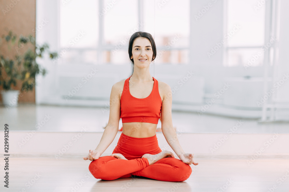 Yoga on the floor. Exercise with a Mat with a beautiful girl. Relax and stretch stand. Yoga on the floor. Exercise with a Mat with a beautiful girl. Relax and stretch stand.