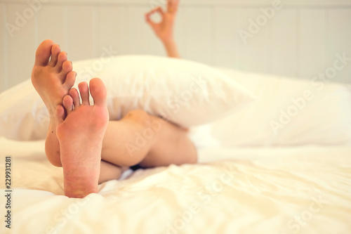 close up top view foot woman on bed relax concept