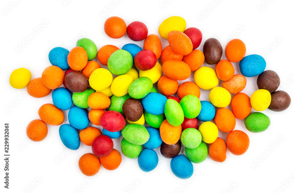 Pile of sweet round colorful candies on white. Top view. Pile of sweet round colorful candies on white. Top view.