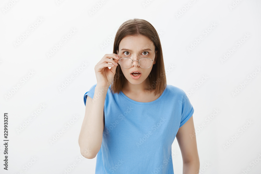 No way, is it true. Shocked impressed attractive woman, taking off glasses and looking from under forehead, dropping jaw, hearing unbelievable rumor or gossip, talking with friend in university No way, is it true. Shocked impressed attractive woman, taking off glasses and looking from under forehead, dropping jaw, hearing unbelievable rumor or gossip, talking with friend in university