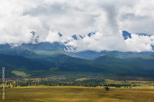 Scenic view of the snow-covered North-Chuya range in the Altai mountains in the summer, Siberia, Russia photo