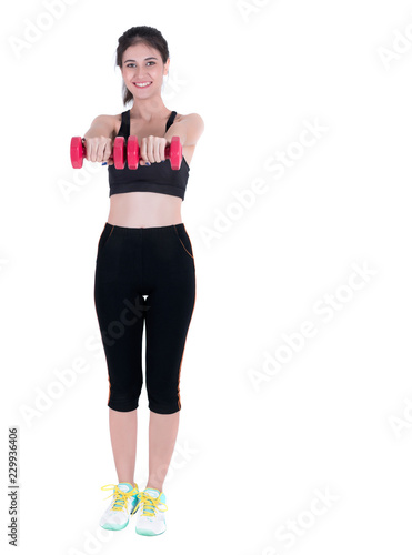 Smiling young Asian woman in sportswear lifting red dumbbells isolated on white background