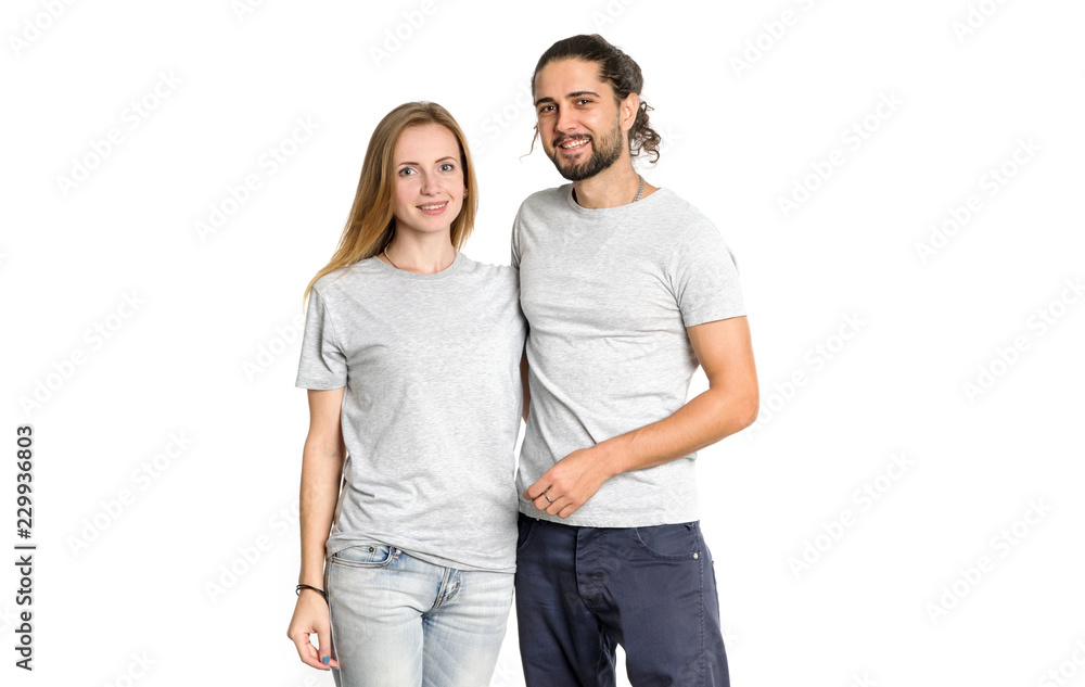 Fototapeta premium Portrait of happy couple on white background. Couple man and woman hugging and looking at camera.