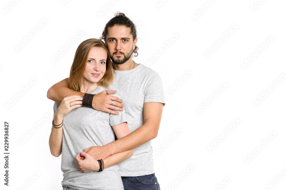 Portrait of happy couple on white background. Couple man and woman hugging and looking at camera. Portrait of happy couple on white background. Couple man and woman hugging and looking at camera.
