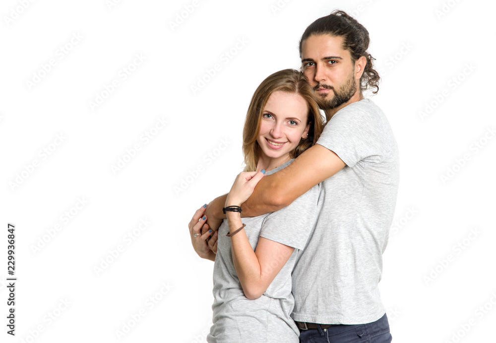 Portrait of happy couple on white background. Couple man and woman hugging and looking at camera. Portrait of happy couple on white background. Couple man and woman hugging and looking at camera.