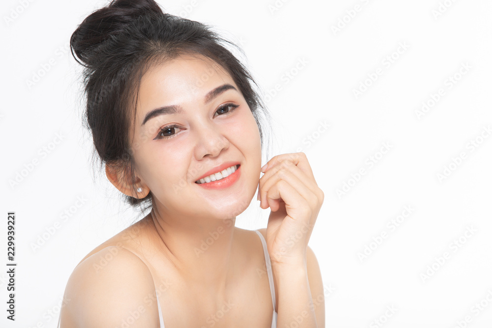 Beautiful smiling woman with clean skin, natural make-up, and white teeth on white background Beautiful smiling woman with clean skin, natural make-up, and white teeth on white background