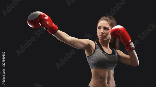 Gorgeous young woman with boxing gloves