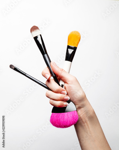 hand with makeup brush