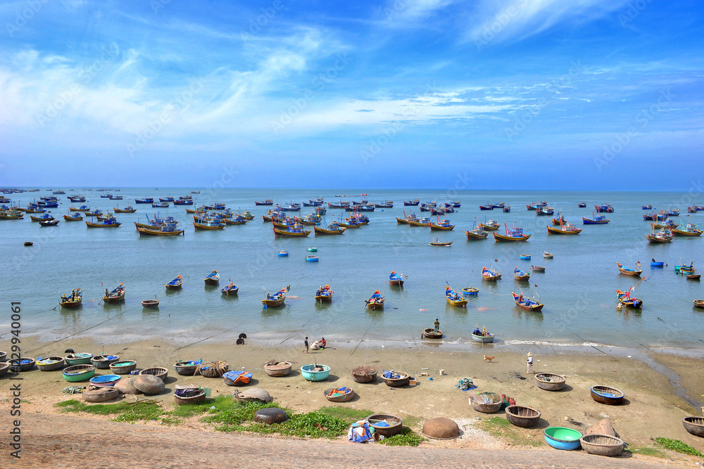 Vietnamese fishing boats in the morning after hard night of fishing. Mui Ne, Vietnam Vietnamese fishing boats in the morning after hard night of fishing. Mui Ne, Vietnam