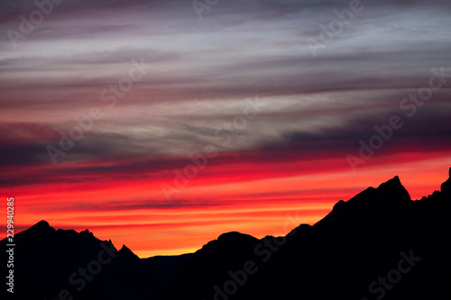 Mountains silhouettes on colorful sunrise