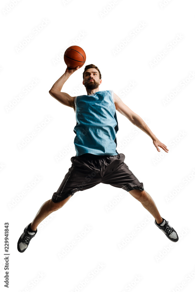 Shooting basketball player on white