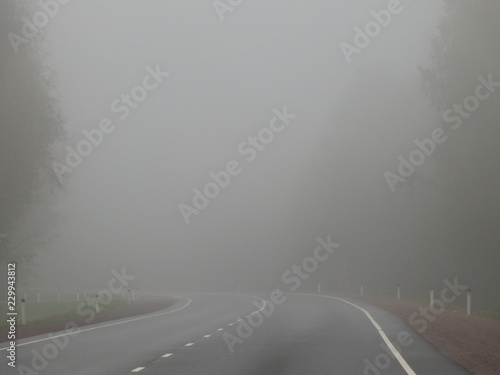 Empty road in heavy fog