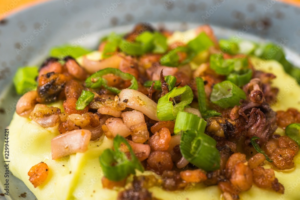 Small pieces of seafood mix with mashed potato, closeup. Small pieces of seafood mix with mashed potato, closeup.