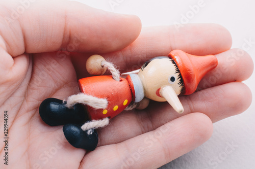 Wooden pinocchio doll with ...
