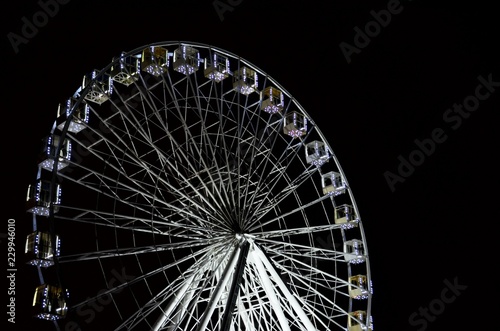 Ferris wheel at night on black background