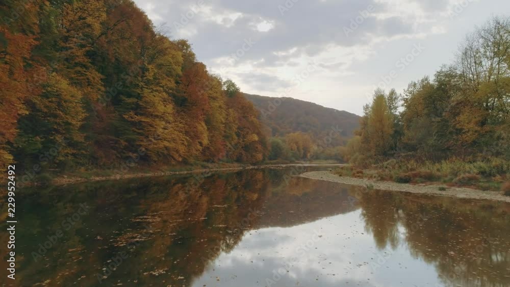 Aerial view: Flying over the river. Incredible autumn landscape Aerial view: Flying over the river. Incredible autumn landscape