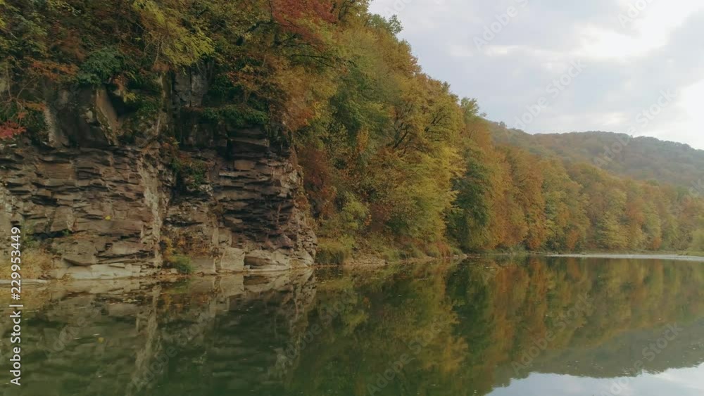 Aerial view: Flying over the river. Incredible autumn landscape Aerial view: Flying over the river. Incredible autumn landscape