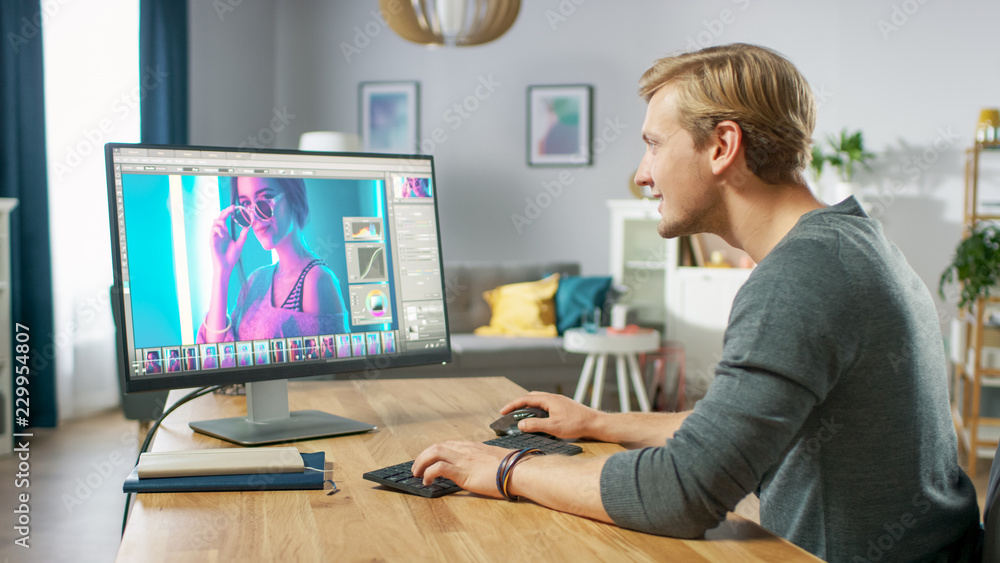 Professional Photographer Works in Photo Editing App / Software on His Personal Computer. Photo Editor Retouching Photos of Beautiful Girl. Mock-up Software Design. Professional Photographer Works in Photo Editing App / Software on His Personal Computer. Photo Editor Retouching Photos of Beautiful Girl. Mock-up Software Design.