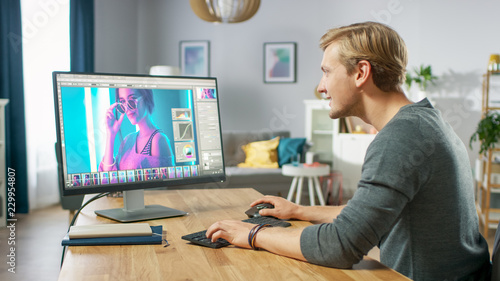Professional Photographer Works in Photo Editing App   Software on His Personal Computer. Photo Editor Retouching Photos of Beautiful Girl. Mock-up Software Design.