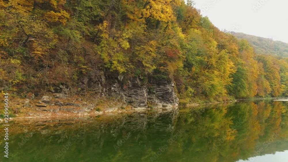 Aerial view: Flying over the river. Incredible autumn landscape Aerial view: Flying over the river. Incredible autumn landscape