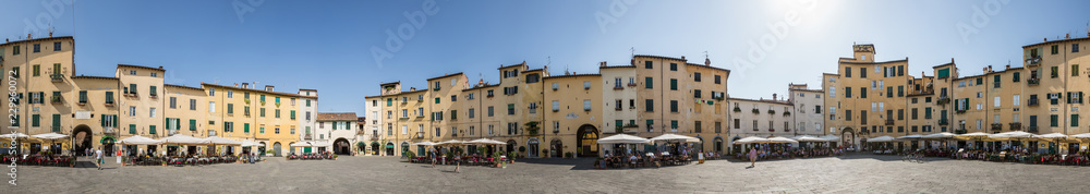 Fototapeta 360 degree panorama of Piazza dell'Anfiteatro which is a public square in the northeast quadrant of walled center of Lucca, region of Tuscany, Italy