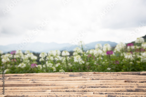 Empty wooden bamboo table abstract blurred nature background of nature.used for display or montage your products.Mock up for display of product