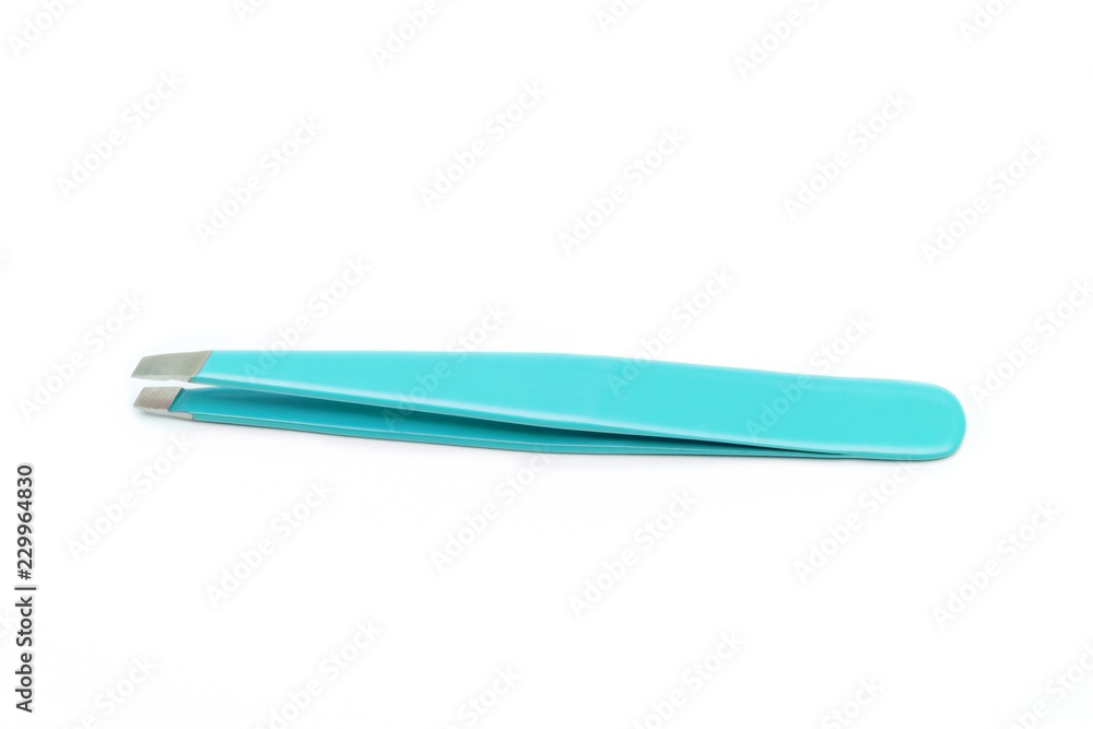 Bright blue-green clean tweezers close-up on white background shot with studio light Bright blue-green clean tweezers close-up on white background shot with studio light