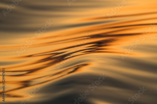 Golden sunset reflected on a river photo