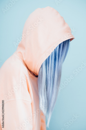 Woman With Long Blue Dyed Hair in Orange Hoodie photo