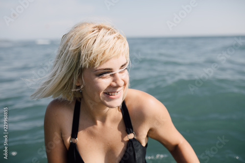 Portrait of a beautiful blonde woman on the beach photo