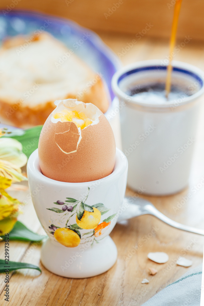 Breakfast of coffee with egg and toast on a wooden table Breakfast of coffee with egg and toast on a wooden table
