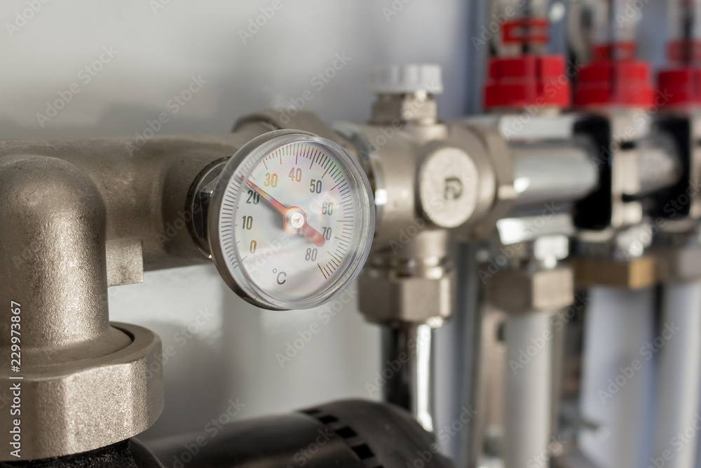 pipefitter installing system of heating. manometer. warm floor system pipefitter installing system of heating. manometer. warm floor system